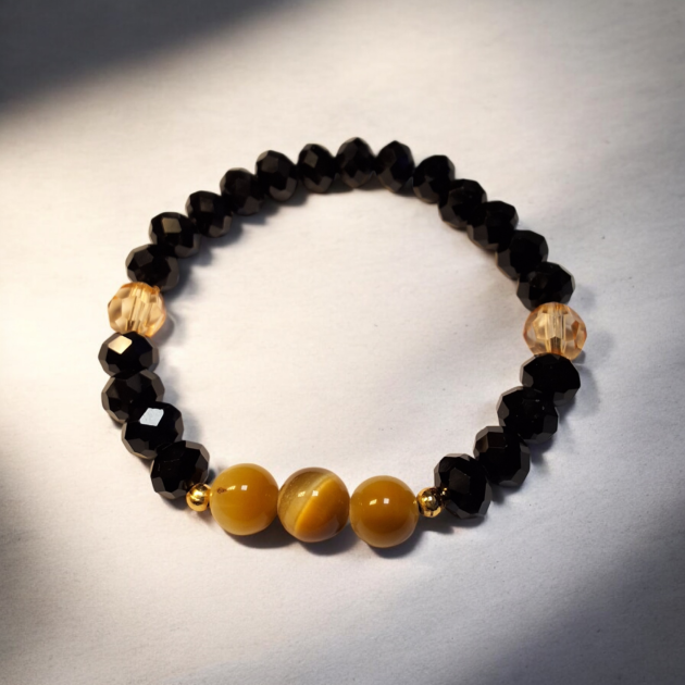 أسوارة خرز أسود مضلع ملكي مع حجر عين النمر