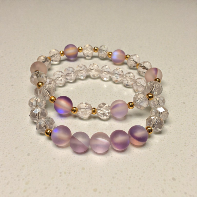طقم أسوارتين كريستال شفاف مع خرز بنفسجي ناعم